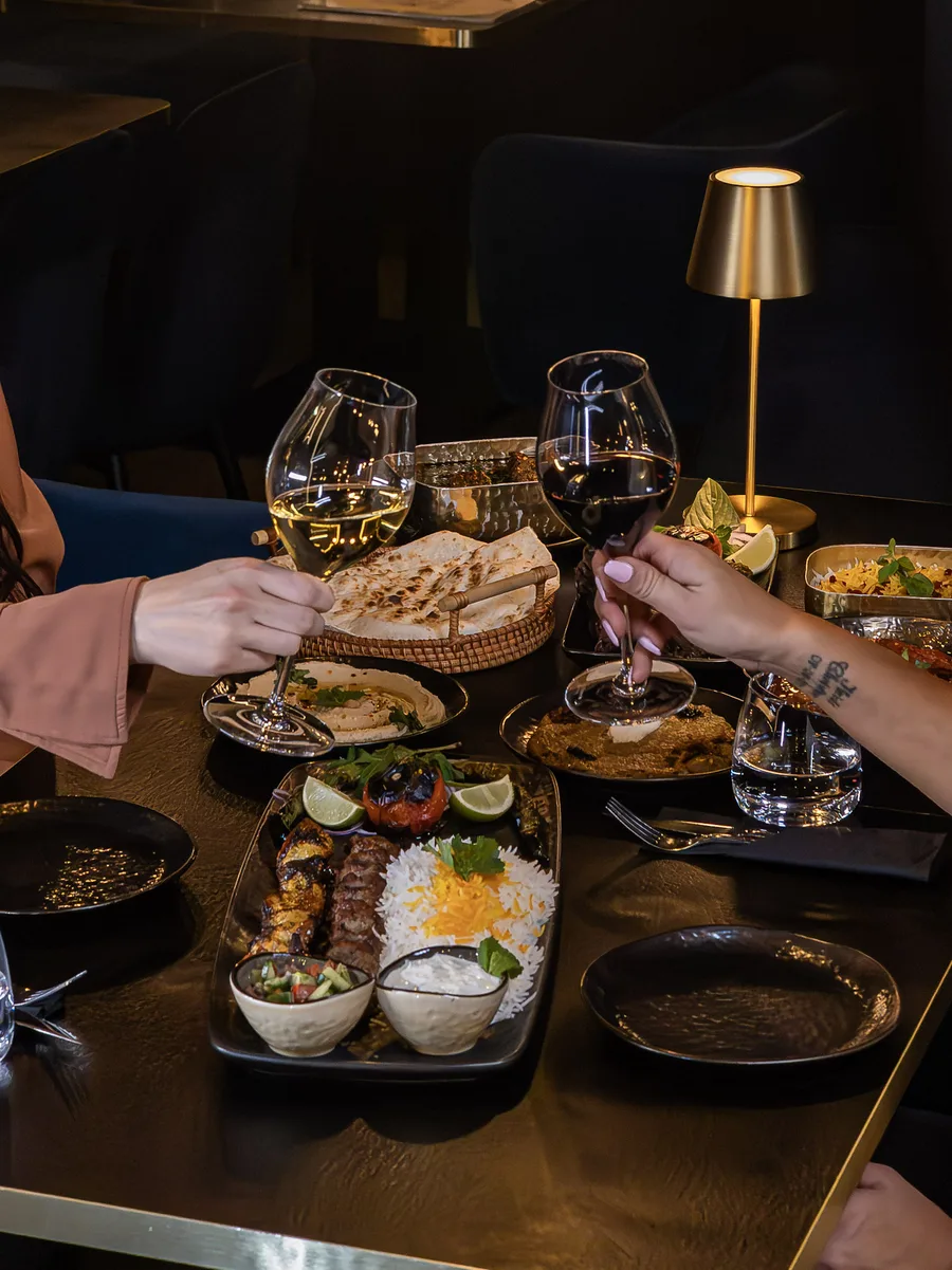Guests raising a toast at the table