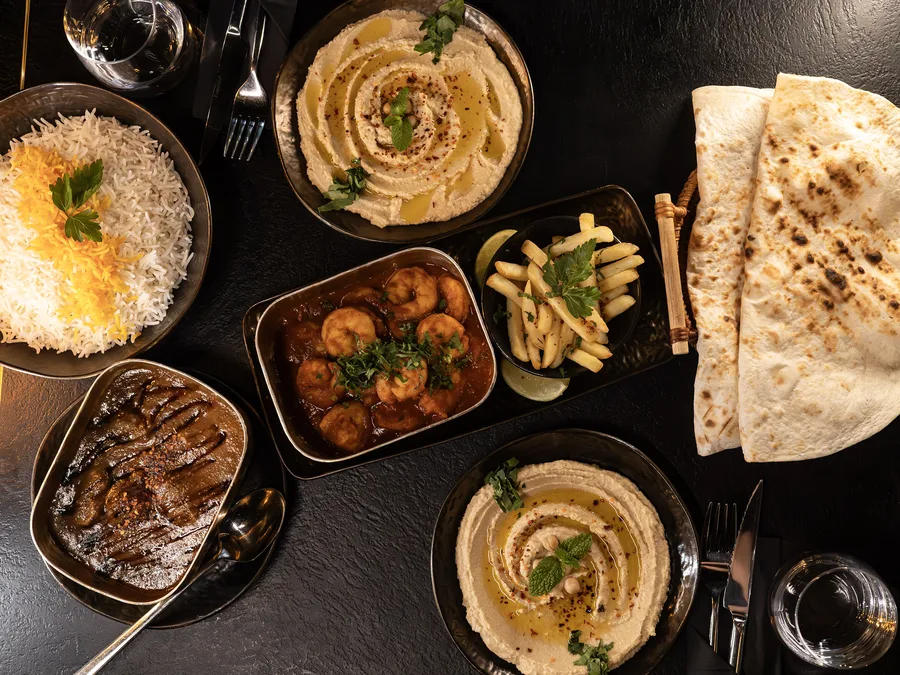 Prawns in tomato sauce, hummus and naan bread