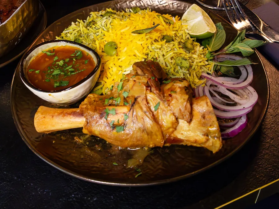Lamb shank with saffron rice
